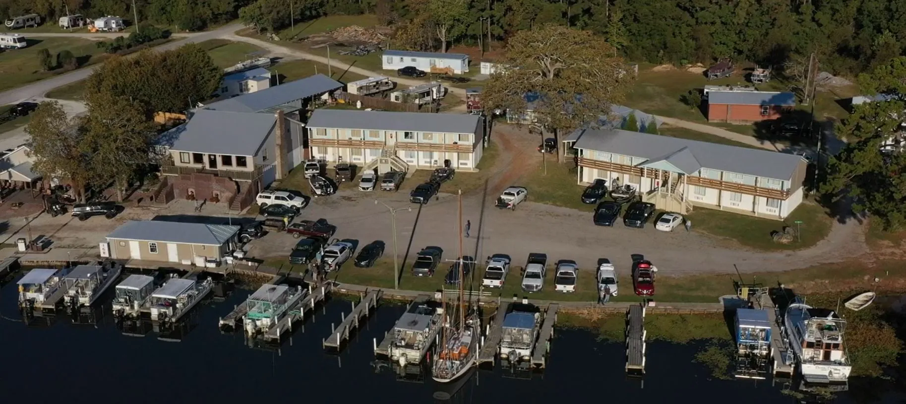 Aerial view of waterfront marina, lodging buildings, and RV park on Lake Moultrie in Cross, SC